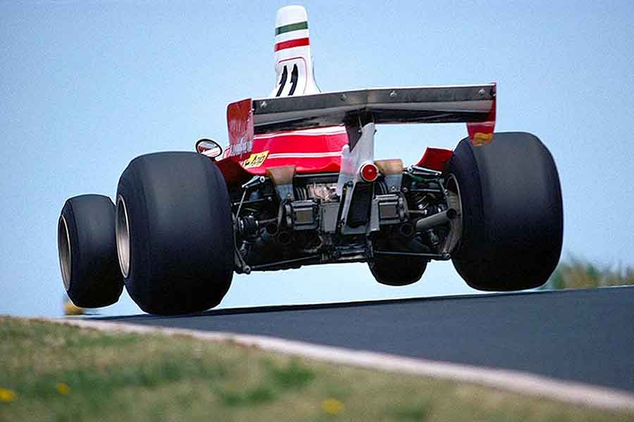 Ferrari 312T on track Rear view at Ferrari 312T in motion